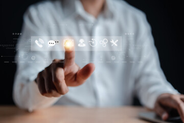 Businessman using a laptop and touching on virtual screen contact icons. Contact us or Customer support hotline people connect. ( email, address, live chat, internet wifi )