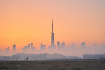 Fototapeta na wymiar Dubai skyline covered with mist during sunset