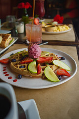 waffles breakfast with ice cream and fruits