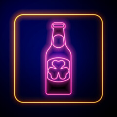 Glowing neon Beer bottle with clover trefoil leaf icon isolated on black background. Happy Saint Patricks day. National Irish holiday. Vector