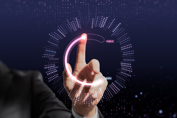 Close up of businessman hand pointing at abstract glowing max and min scale hologram on dark...