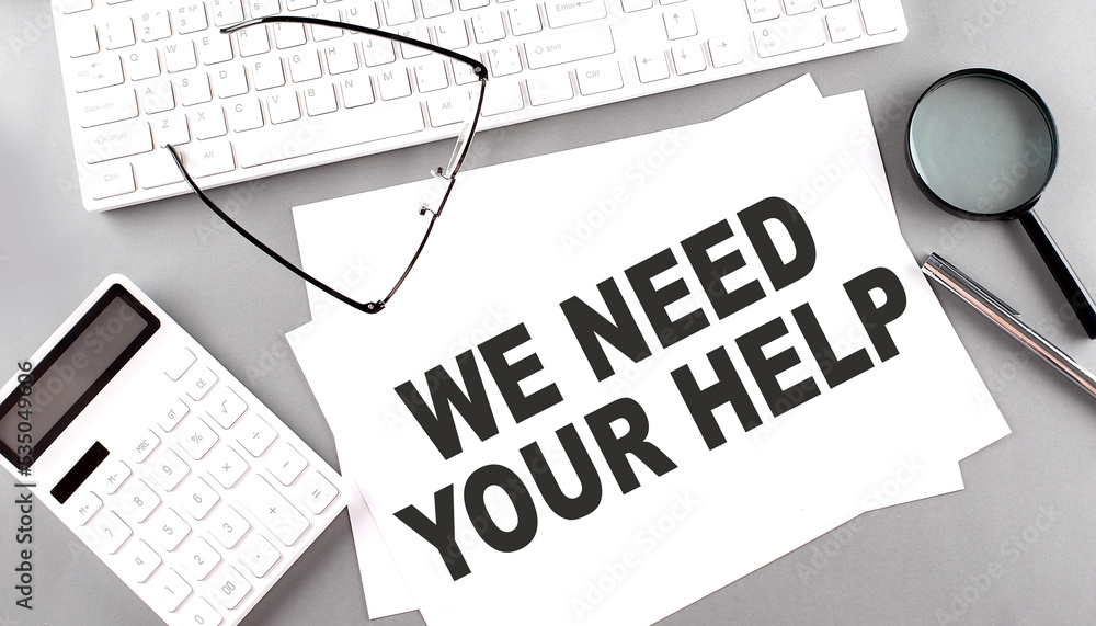 Poster we need your help text on paper with keyboard, calculator on grey background
