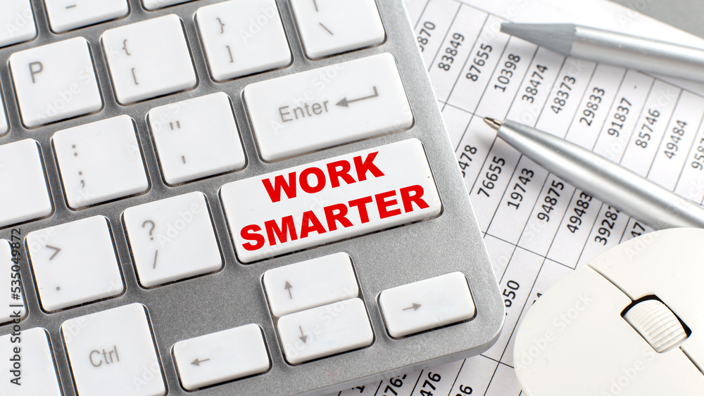 Poster work smarter text on a keyboard wirh chart and pencil