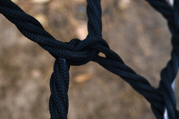 A knot in a black rope.