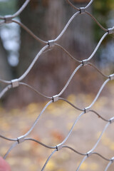 Stainless metal mesh. Seamless texture of hand woven mesh fence made of stainless wire.