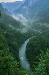 view of a canyon and river in the mountains