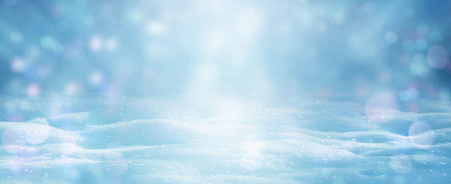 Winter Christmas background with magic Bokeh lights. Light blue snowscape. Banner, Panorama.