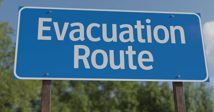 4k Drive By Pan of Evacuation Route Road Sign.
