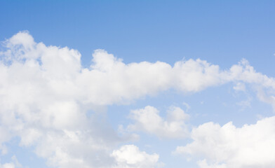 Soft fluffy clouds on blue sky