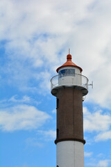 Lighthouse on the island of Poel on the Baltic Sea with clouds and sky