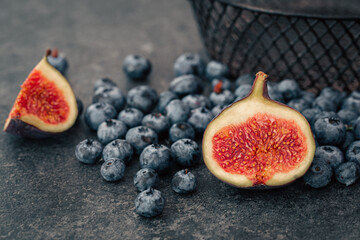 Close-up, figs in the cut among the berries.