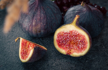 Close-up, fig fruit on a blurred dark background.