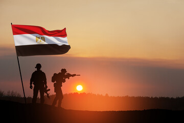 Silhouette Of Soliders Against the Sunrise in desert . Concept - armed forces of Egypt. Egypt...