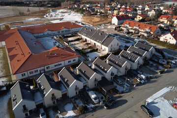 Winter season in Europe town, aerial view. Residential neighborhood quarters with town houses in european suburban area