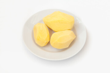 Peeled potatoes on a plate