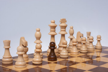 Wooden chess pieces on the chessboard