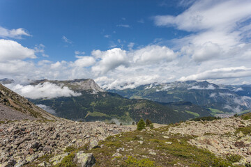 Fototapeta na wymiar Majestic summer alpine panorama on the border between Switzerland, Italy and Austria. Resia Pass, Alto Adige Sudtirol, Italy