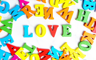 Word LOVE made from colorful wooden letters