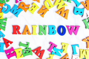 Word RAINBOW made from colorful wooden letters
