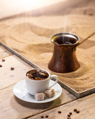 Turkish coffee with cooking in sand. Vertical frame