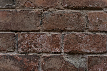 Old brick wall with ruined bricks. Aged grunge wall background. Vintage Texture. Vertical Web banner or Wallpaper With Copy Space for design.