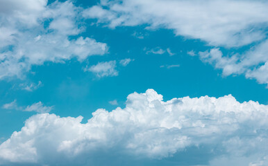 Naklejka na ściany i meble Shot of white clouds on blue sky.