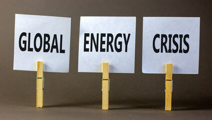 Global energy crisis symbol. Concept words Global energy crisis on white papers on wooden clothespins. Beautiful grey table grey background. Business and global energy crisis concept. Copy space.