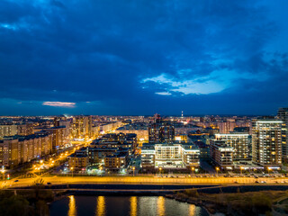 Panorama night city Kazan. View of the new quarters of new buildings in the evening illumination