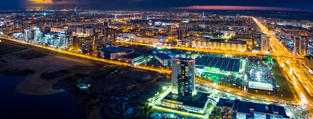 Fototapeta na wymiar Panorama night city Kazan. View of the new quarters of new buildings in the evening illumination