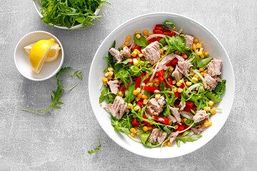 Canned tuna salad with arugula and fresh vegetables, top view - 535066833