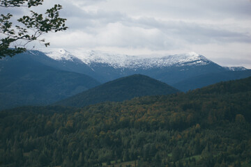 mountain tops covered with snow, autumn