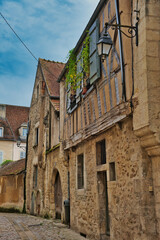 Fototapeta na wymiar Street scene with medieval houses in the old French town of Avallon, department of Yonne 