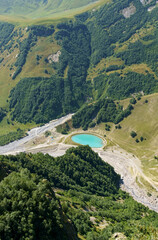 Top view of the lake formed on the site of a quarry in the mountains.