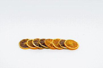 Dry lemon slices. Isolated Slice lemons on white background. selective focus. Dried orange, lemon slices.
