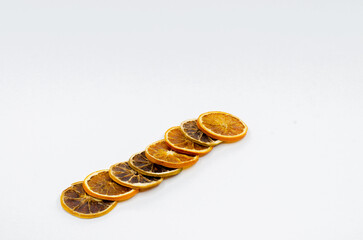 Dry lemon slices. Isolated Slice lemons on white background. selective focus. Dried orange, lemon slices.
