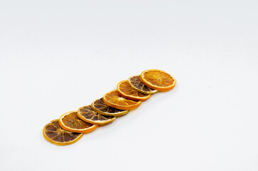 Dry lemon slices. Isolated Slice lemons on white background. selective focus. Dried orange, lemon slices.
