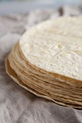 Homemade Wheat Flour Tortillas in a Stack, side view. Close-up.