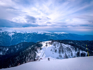 Fototapeta na wymiar Winter landscape in Sheregesh ski resort in Russia, located in Mountain Shoriya, Siberia. Ski slopes and a view of the Sheregesh village