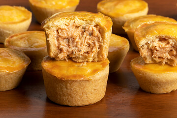 Empadinha de frango, typical appetizer of Brazilian cuisine, visible filling
