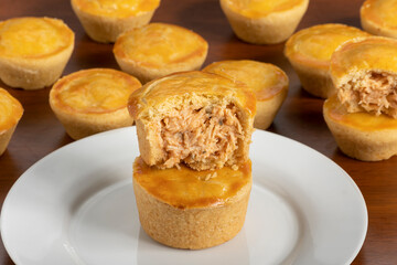 Empadinha de frango, typical appetizer of Brazilian cuisine, visible filling
