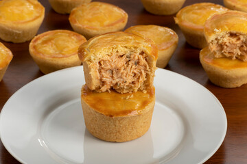 Empadinha de frango, typical appetizer of Brazilian cuisine, visible filling
