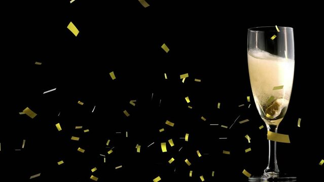 Animation of confetti over glass of champagne