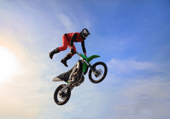 Moto freestyle jump rider on a motorcycle