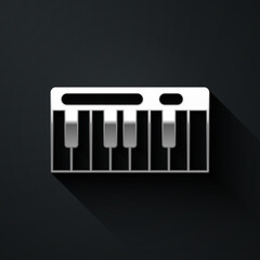 Silver Music synthesizer icon isolated on black background. Electronic piano. Long shadow style. Vector