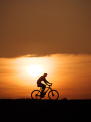 Fototapeta na wymiar Sunset Bike rider silhouette