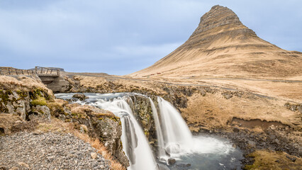 Kirkjufel,the mountain in Iceland with a small watterfall in front of it