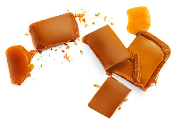 Toffee candy with splash of caramel candies isolated on white background, collection. Top view....