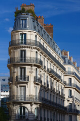 The facade of traditional French house with typical balconies and windows. Paris. - 535078606