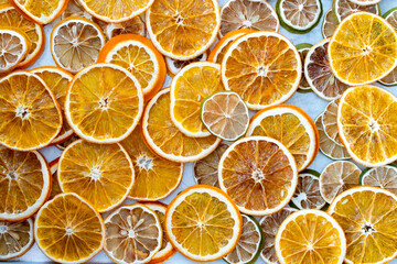 Fototapeta na wymiar dried citrus fruits on a grey metallic background, space for text
