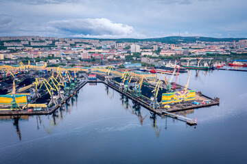 Murmansk, Russia - June 13, 2021: Panoramic aerial view of the port of Murmansk, ships and ship docks. Summer landscape in the north of Russia. Kola Bay of the Barents Sea
